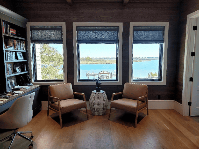 Blue Roman shades installed on three windows in a home in Pender County, NC, adding elegance and style to the room with a sleek, modern design from Coastal Window Fashions