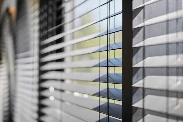 Window blinds with sunlight filtering through, ideal for ventura home window treatments in Pender County, NC