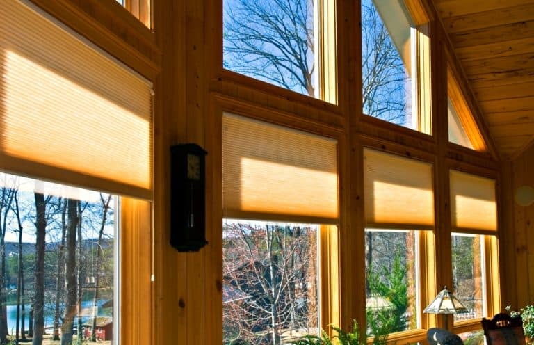 Large windows in a beautiful home in Pender County, NC, showcasing custom window treatments from Coastal Window Fashions, designed to enhance natural light and complement the room’s decor